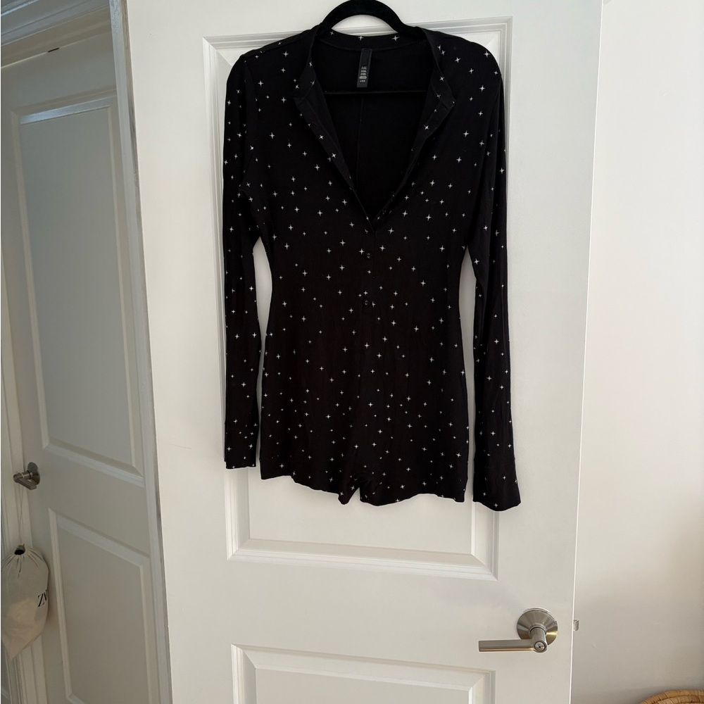 SKIMS - Black Long Sleeve Star Print Romper